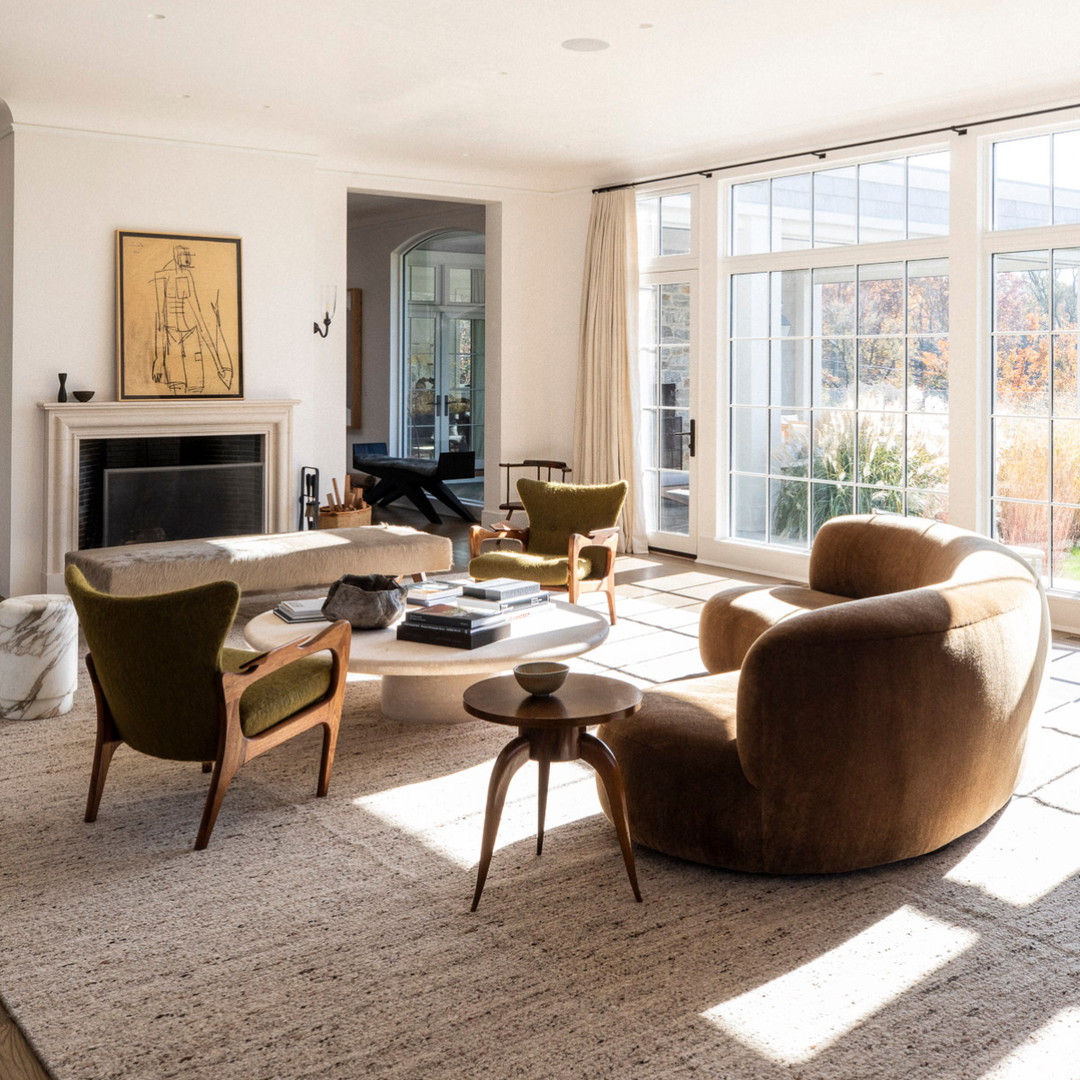 a living room filled with furniture and a fire place