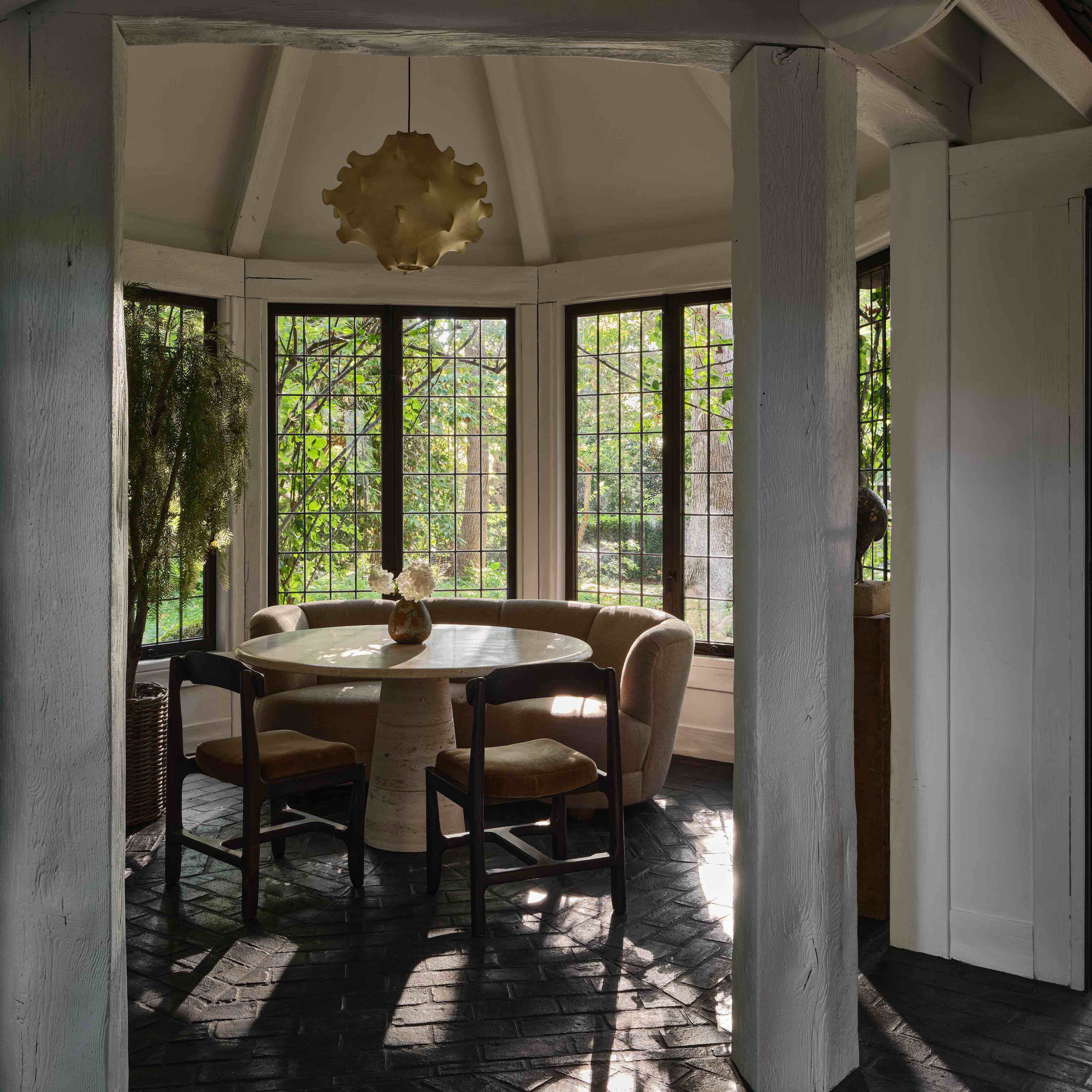 a dining room with a table and chairs