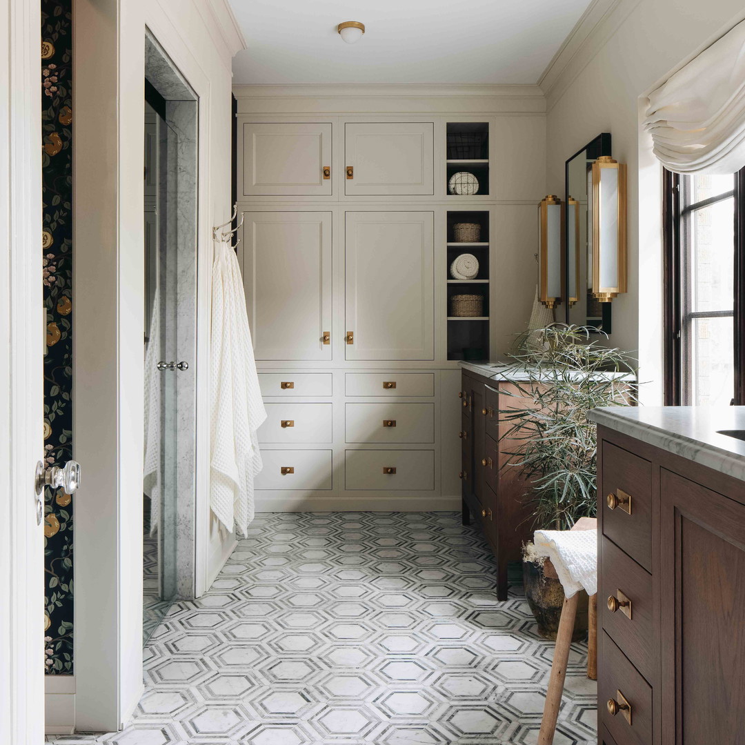 a bathroom with a large mirror and a sink