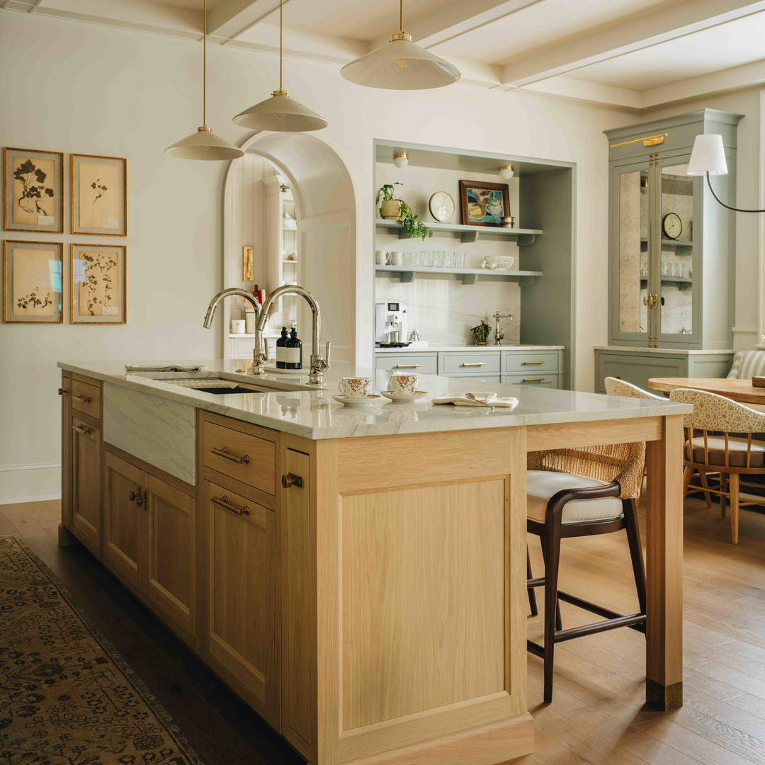 a kitchen with a center island and a dining room table