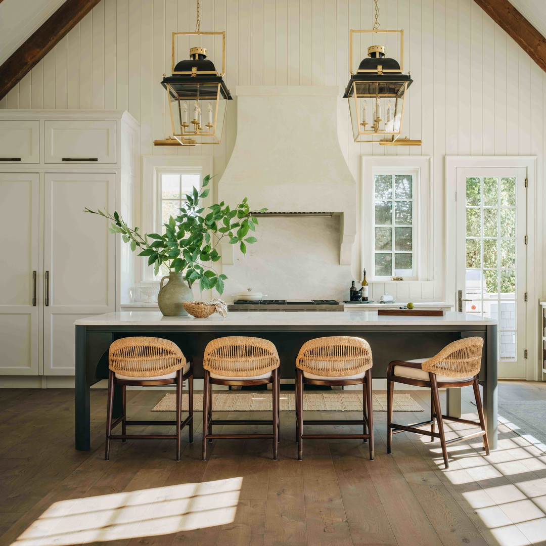 a kitchen with a table and four chairs