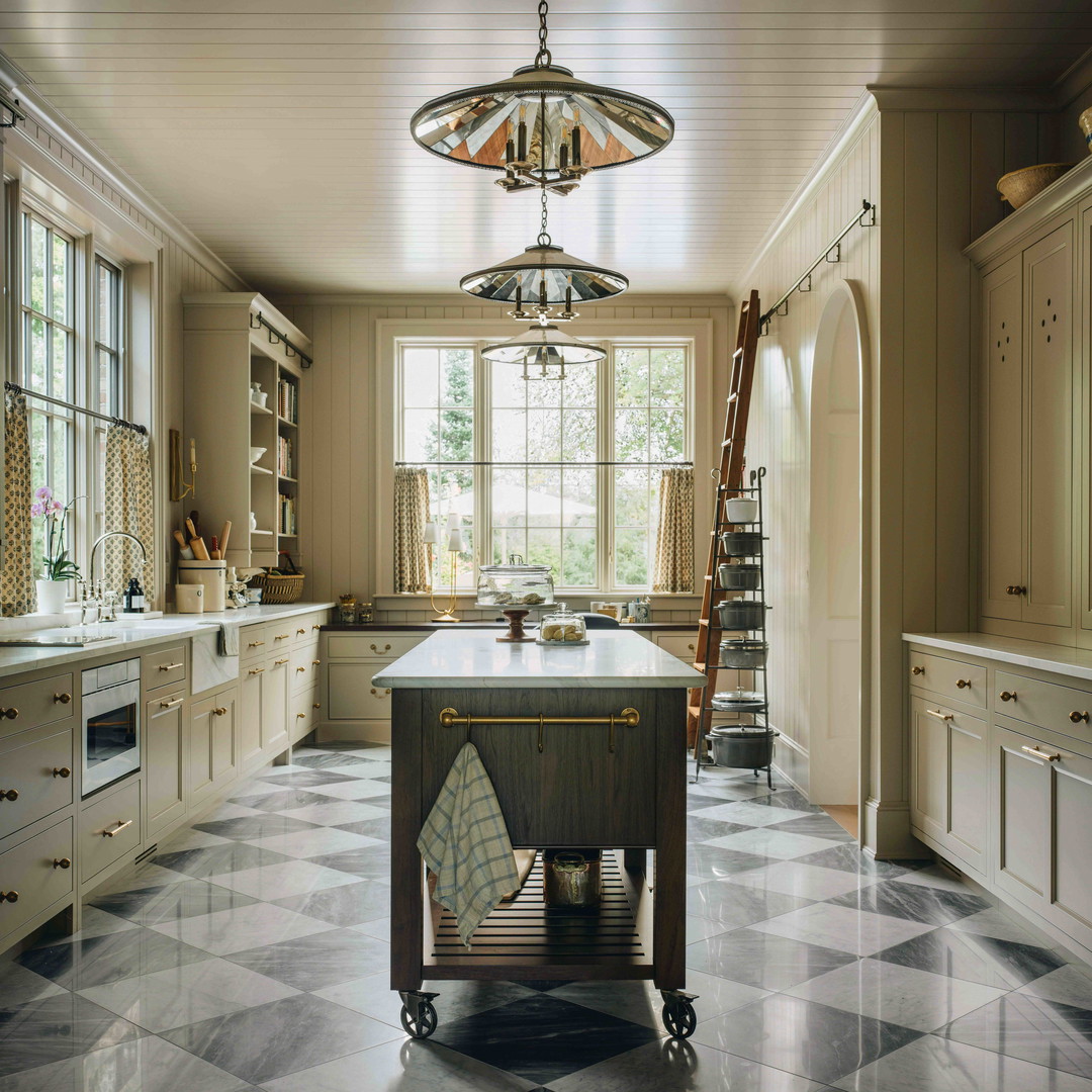 a large kitchen with a center island in the middle of the room