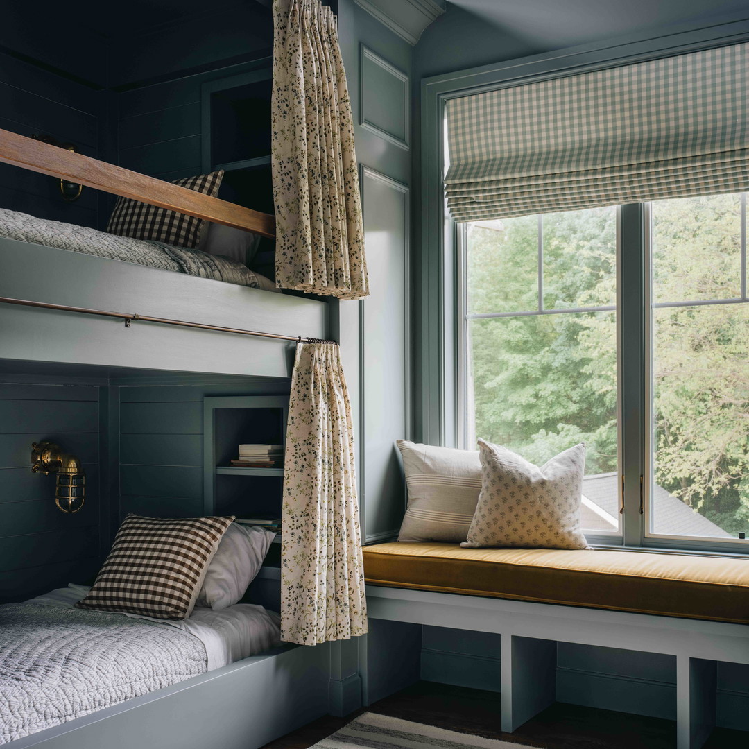 a bedroom with bunk beds and a window