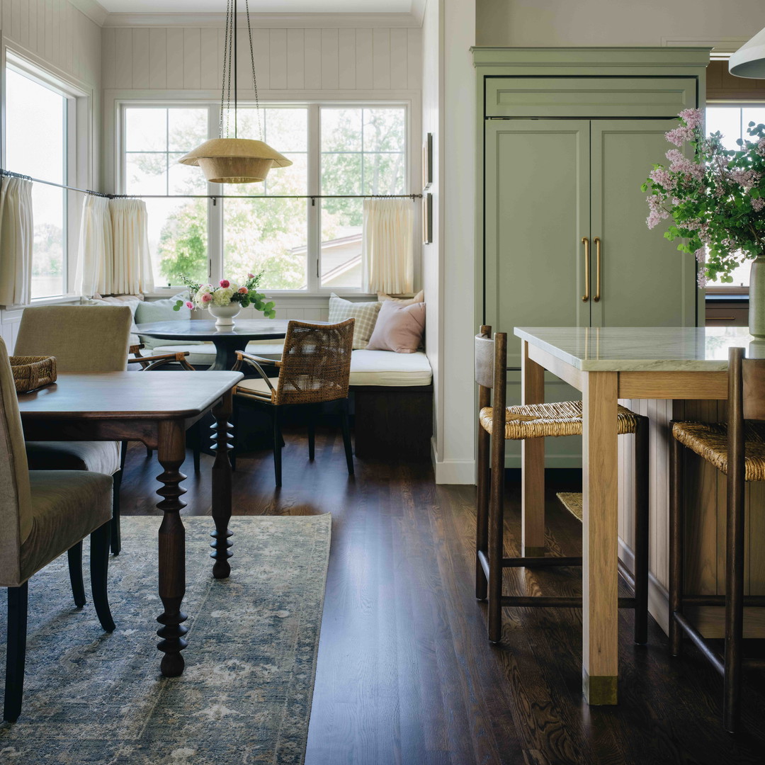 a dining room with a table and chairs