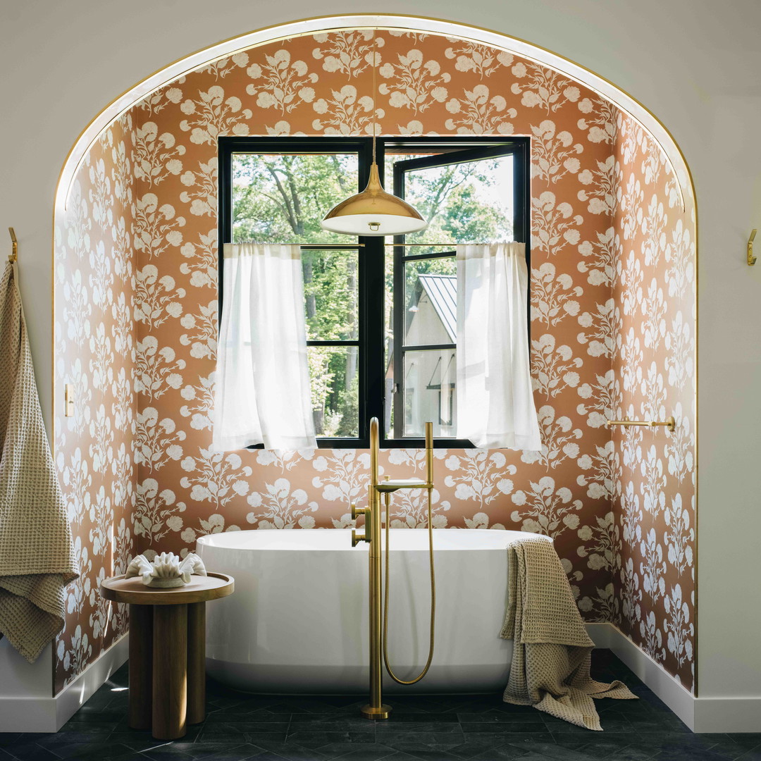 a bathroom with a bathtub and a window