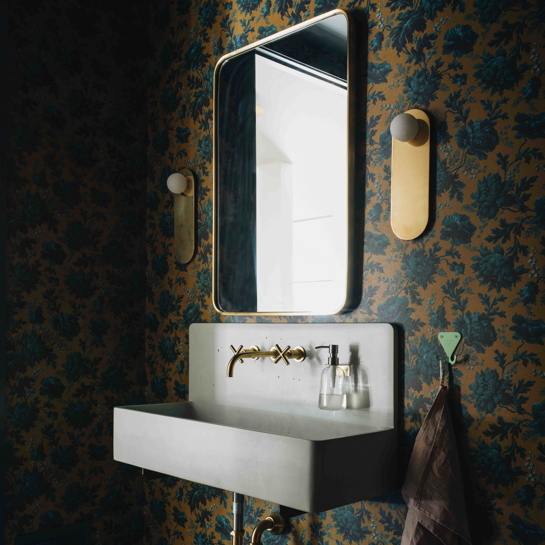 a sink and mirror in a small room