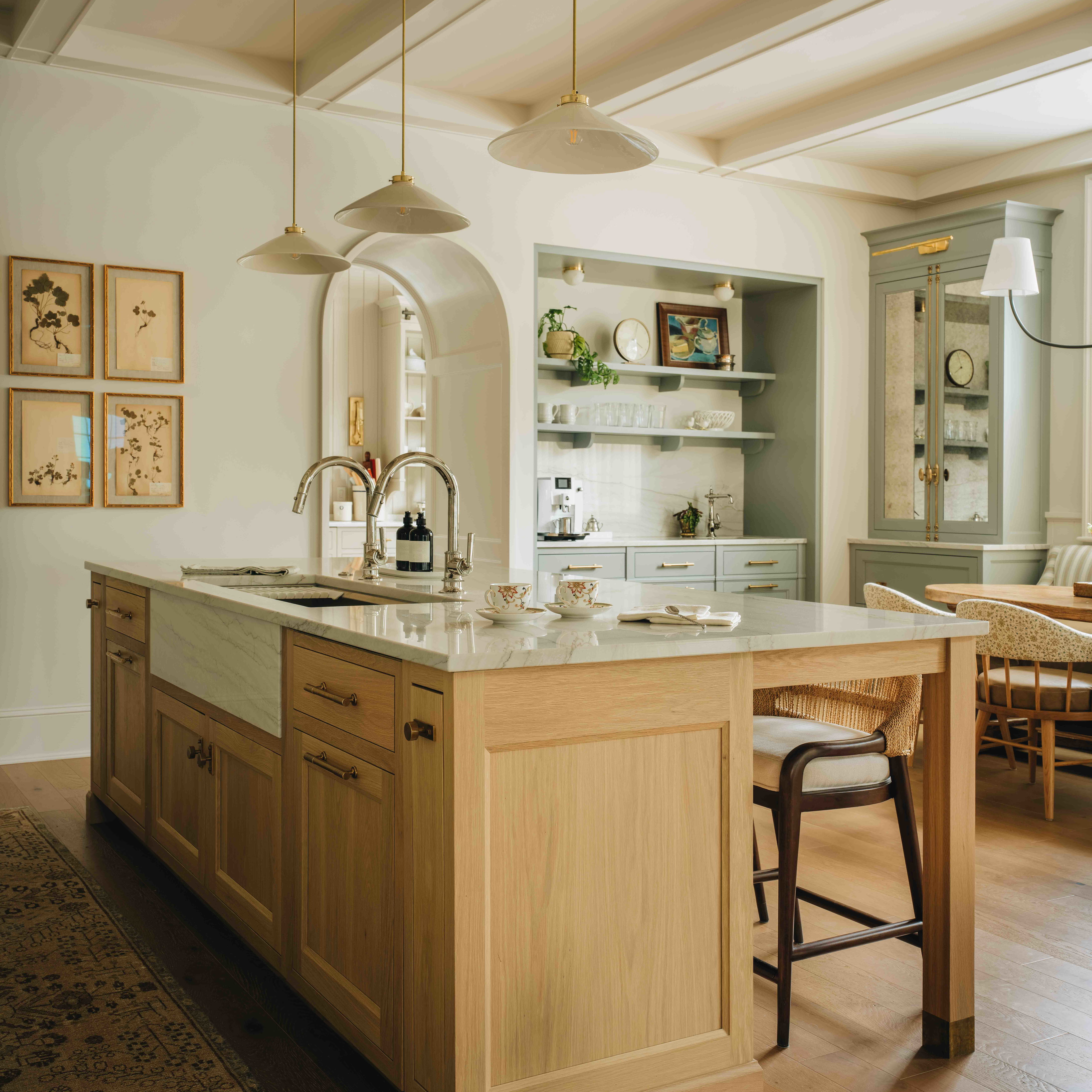 a kitchen with a center island and a dining room table