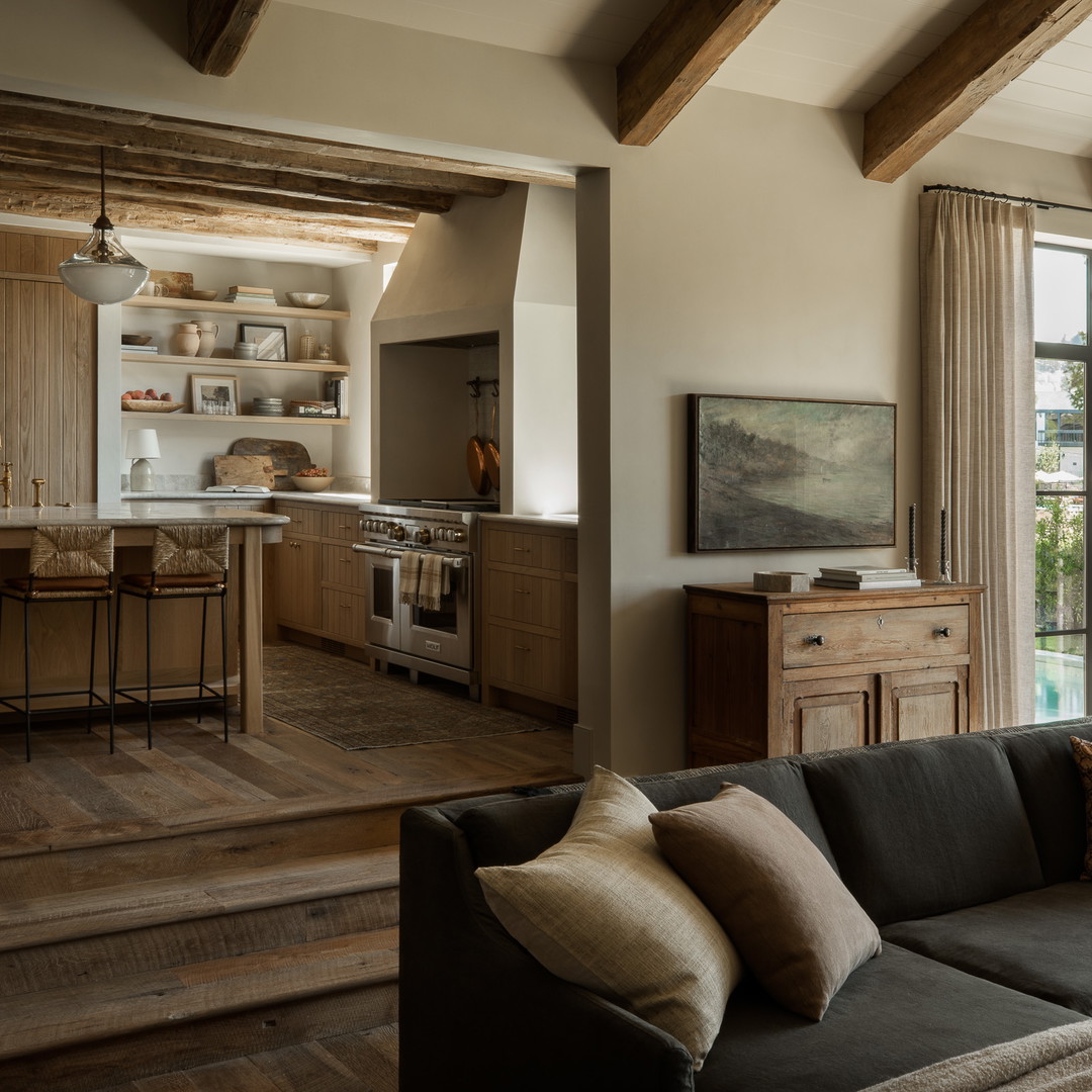 a living room filled with furniture and a large window