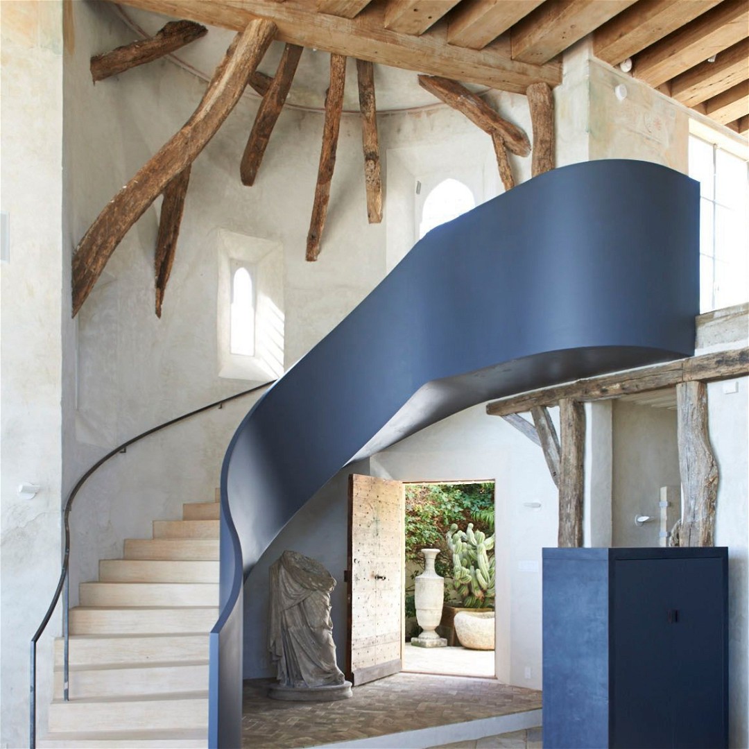 a spiral staircase in a house with stone steps