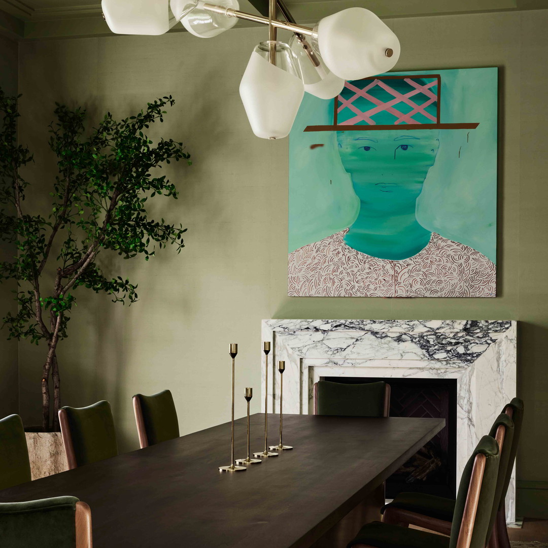 a dining room with a table and chairs