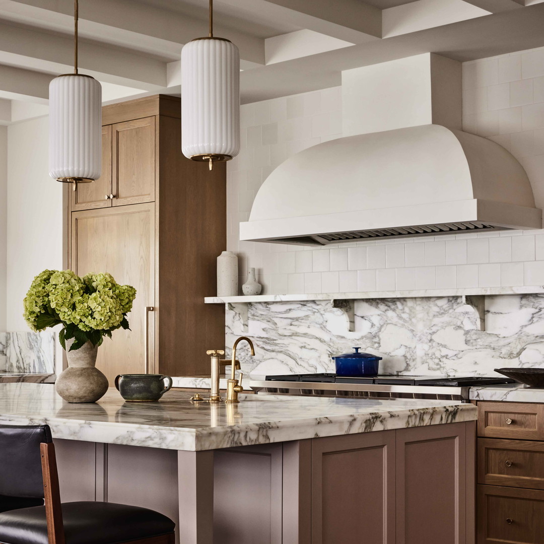 a kitchen with a center island and a stove