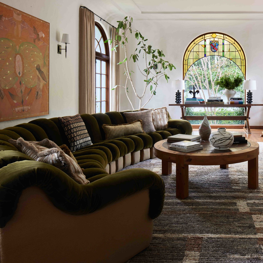 a living room filled with furniture and a fire place