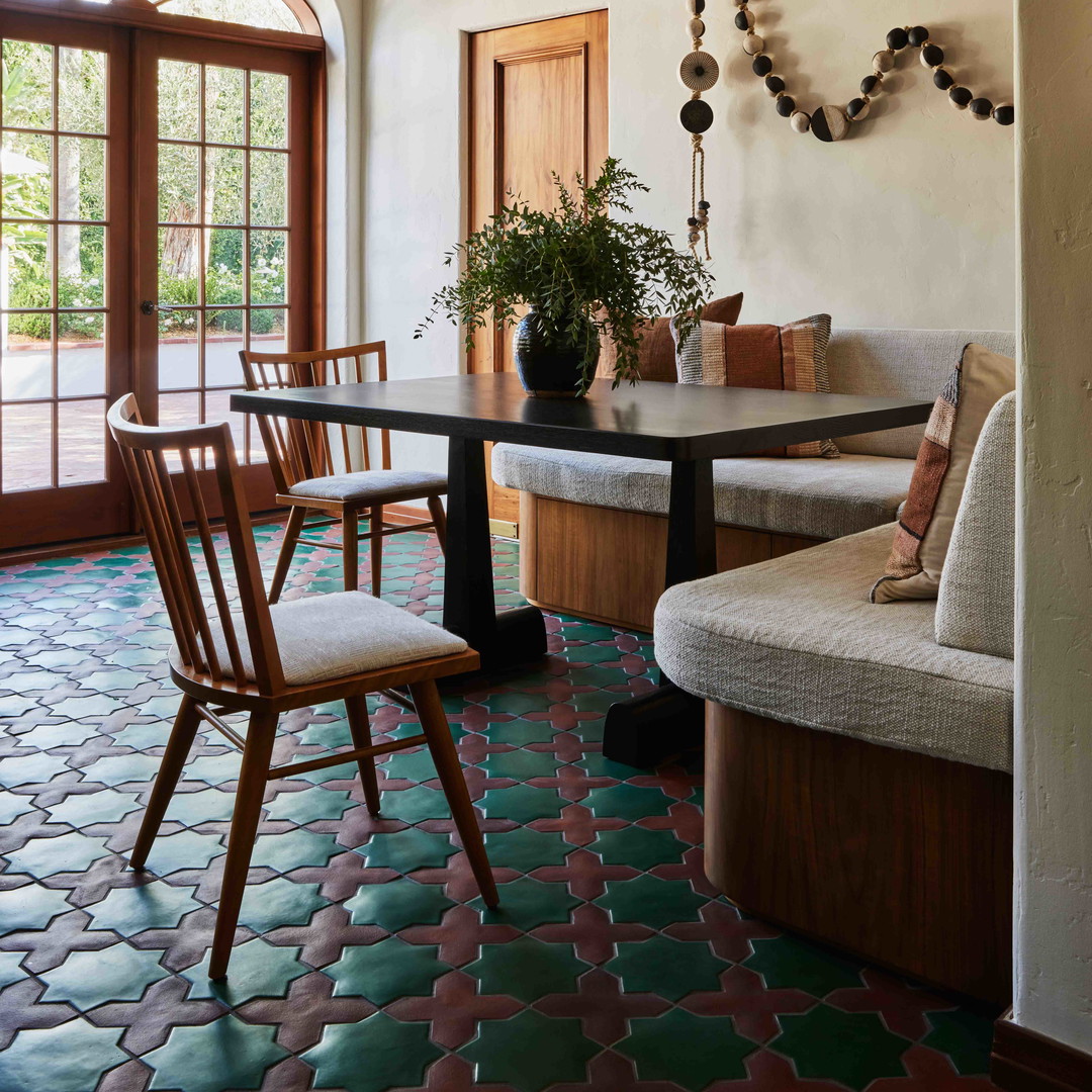 a dining room with a table and chairs