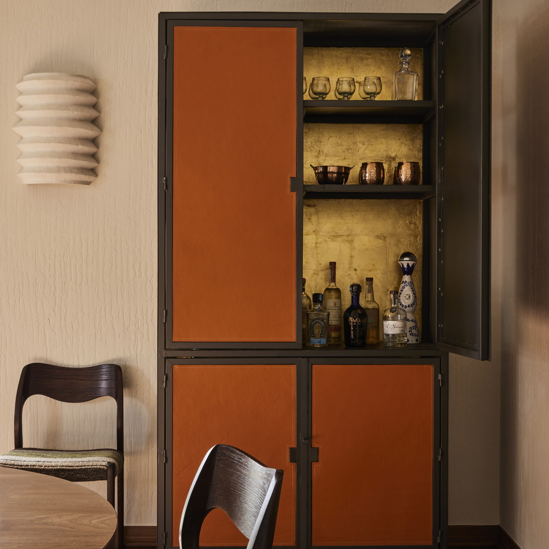 a dining room with a table and a cabinet