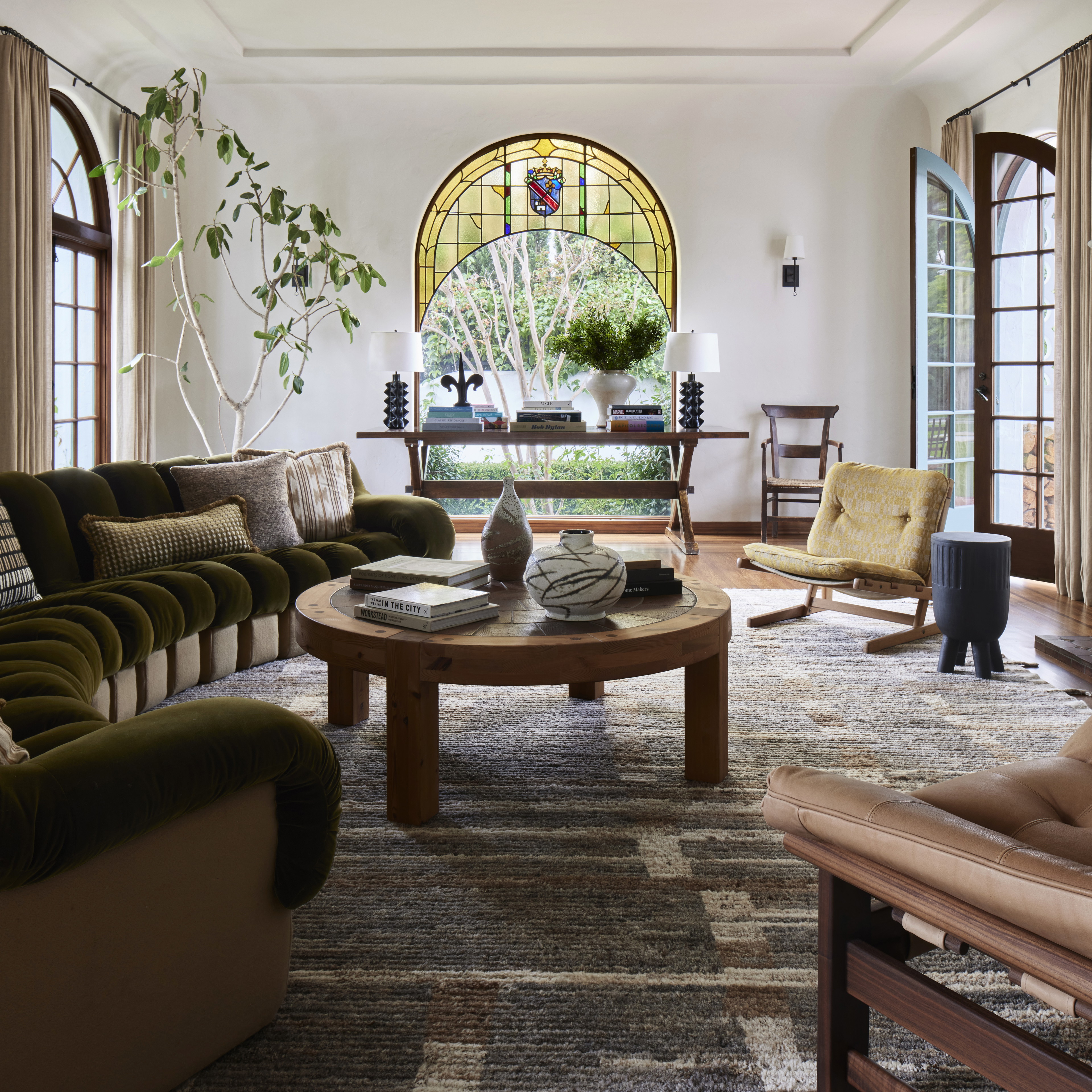 a living room filled with furniture and a fire place