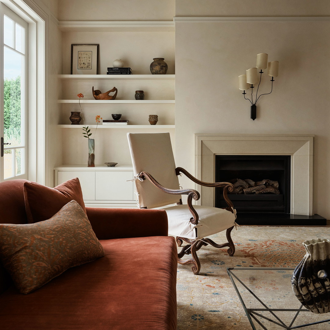 a living room filled with furniture and a fire place