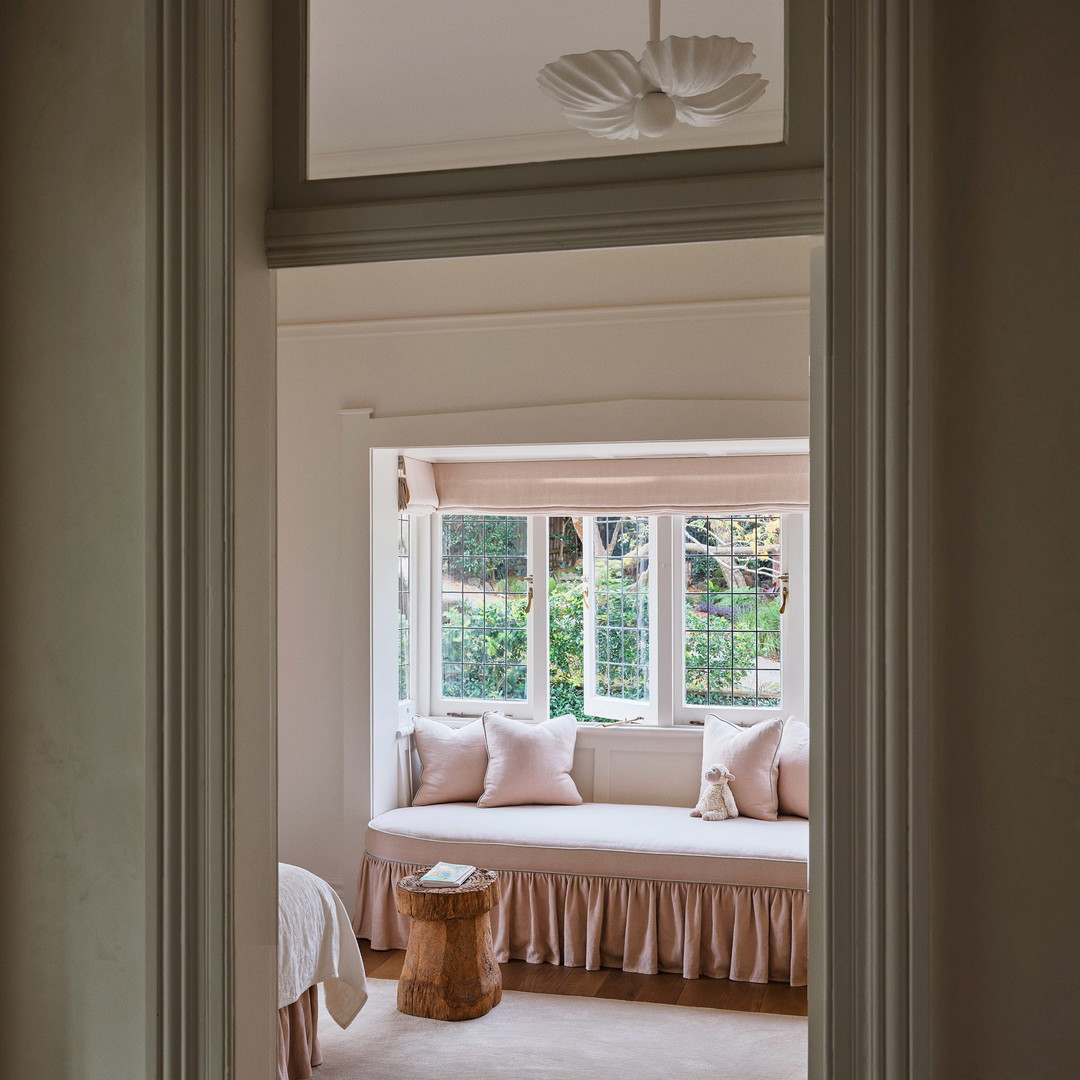 a room with a window and a bench in it