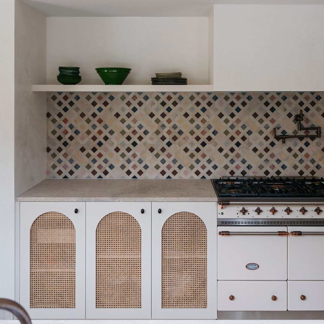 a kitchen with a stove top oven next to a counter