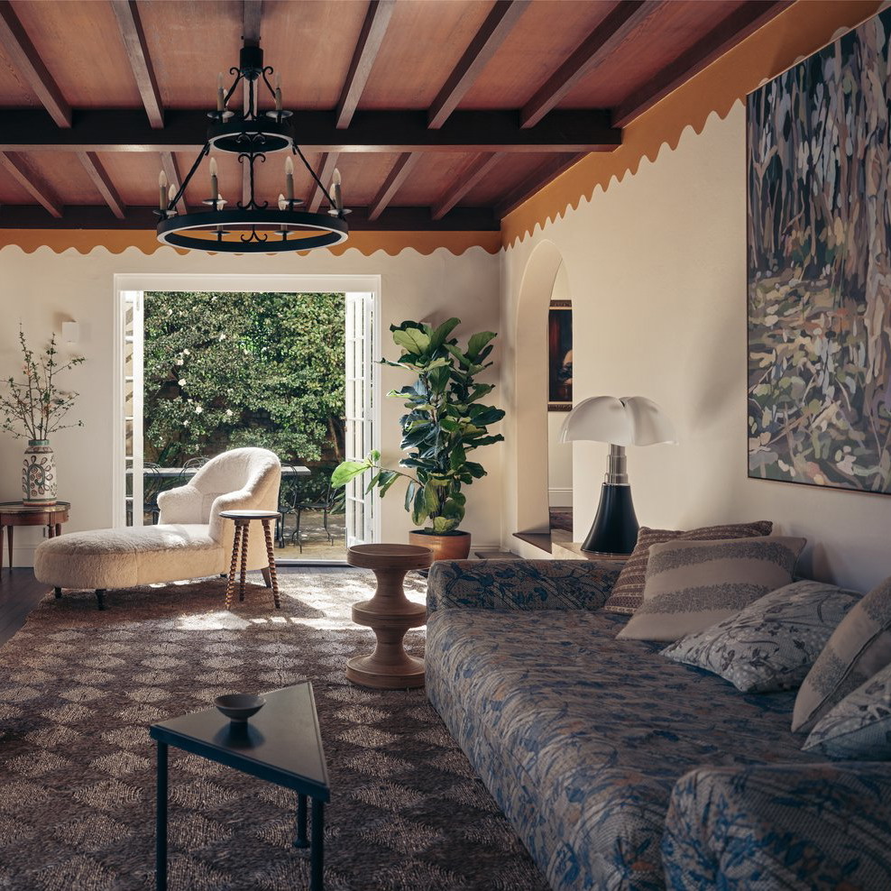 a living room filled with furniture and a chandelier