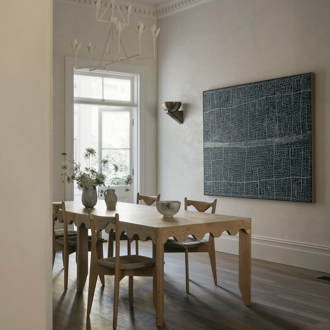 a dining room with a table and chairs