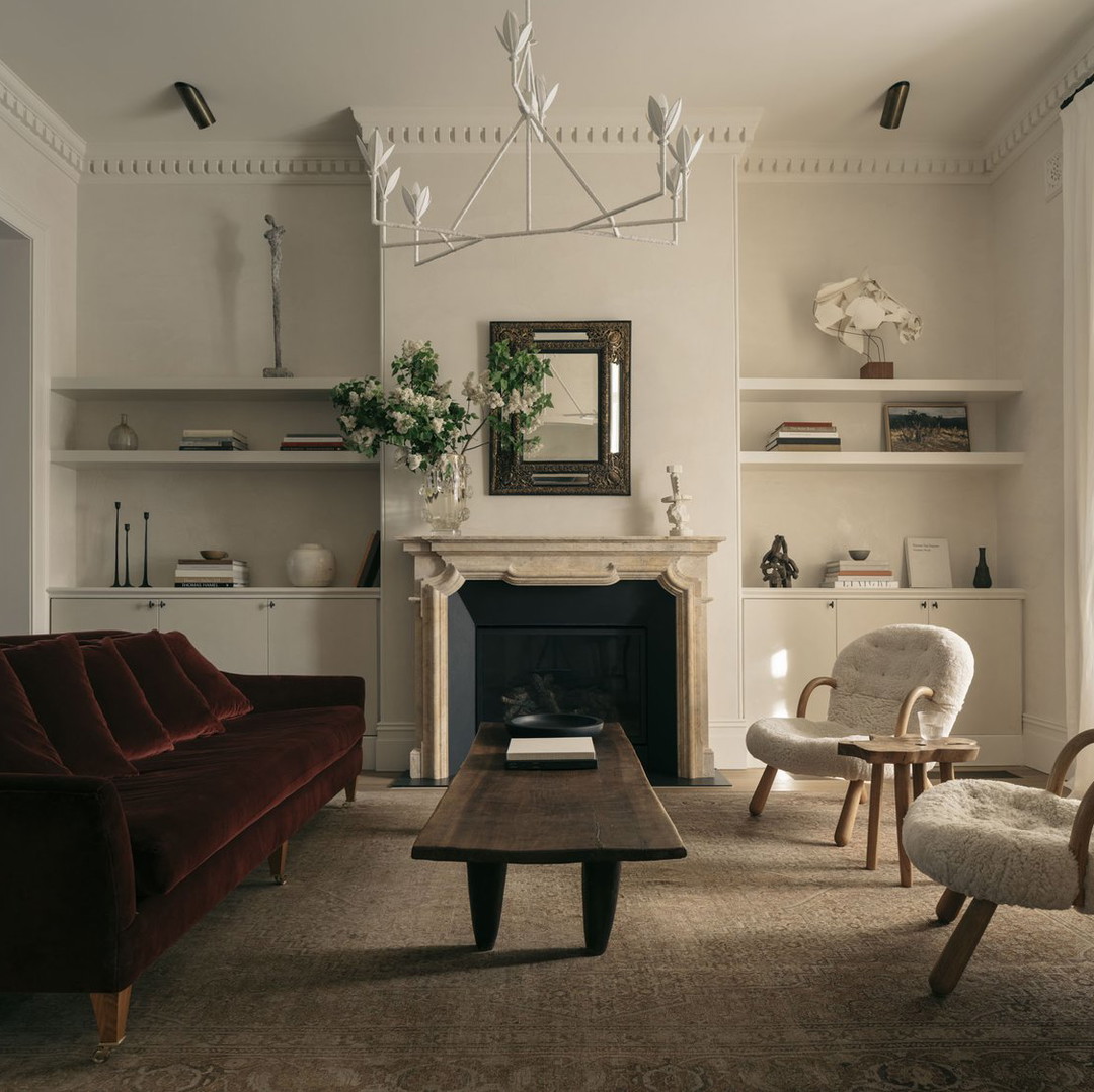 a living room filled with furniture and a fire place