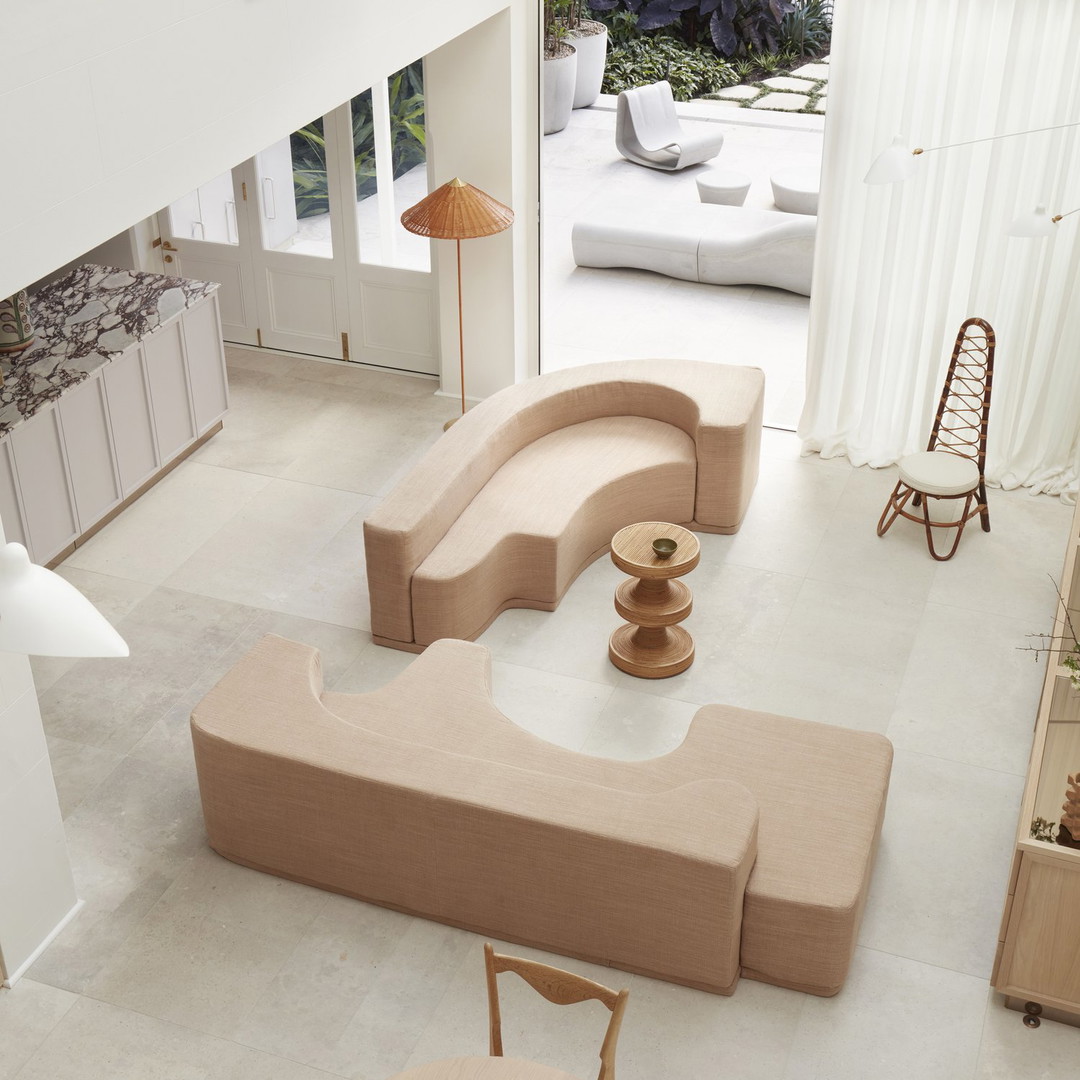 a living room filled with furniture and a table