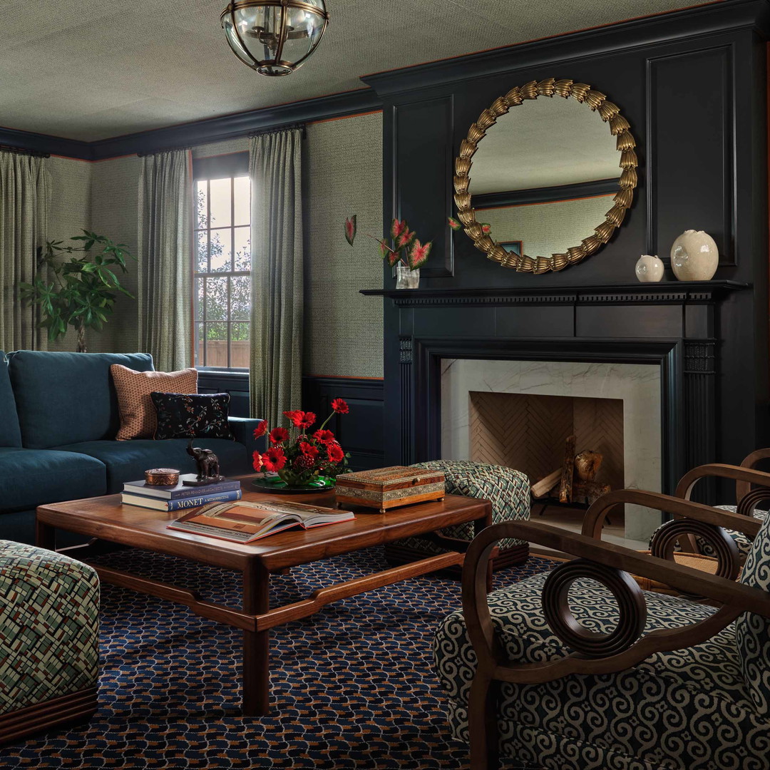 a living room filled with furniture and a fire place