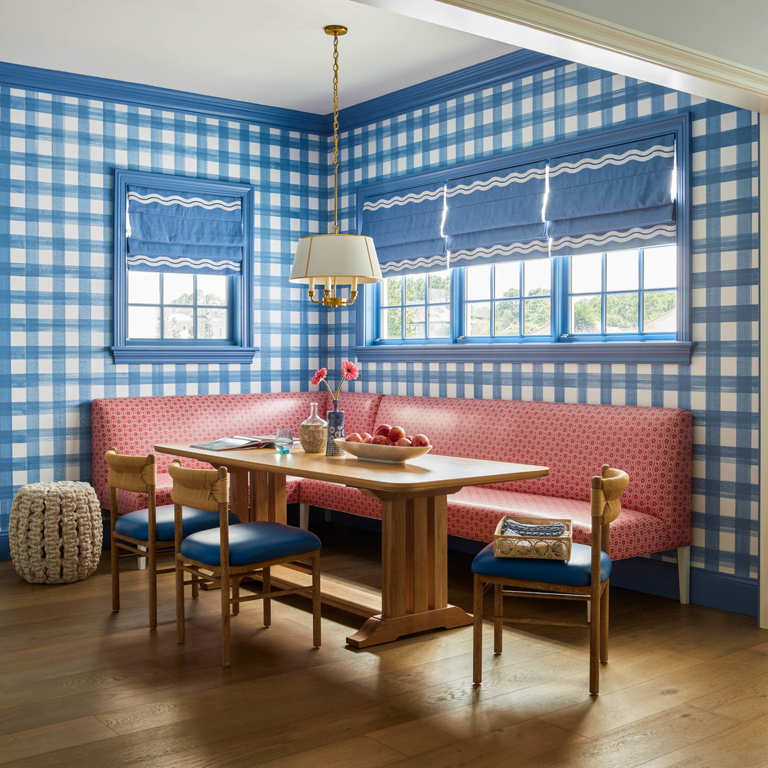 a blue and white checkered wall in a dining room