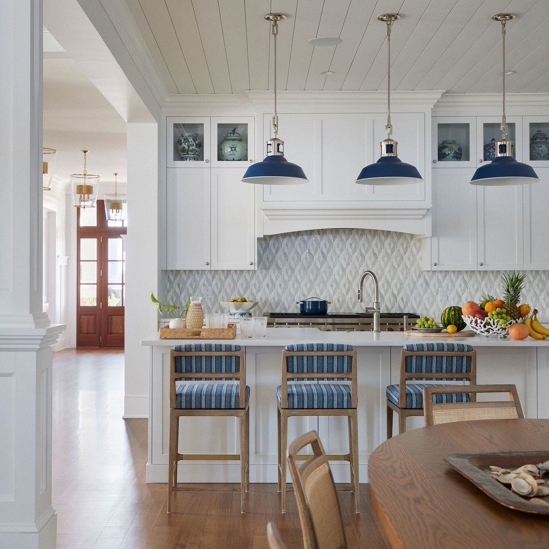 a kitchen with a wooden table and chairs