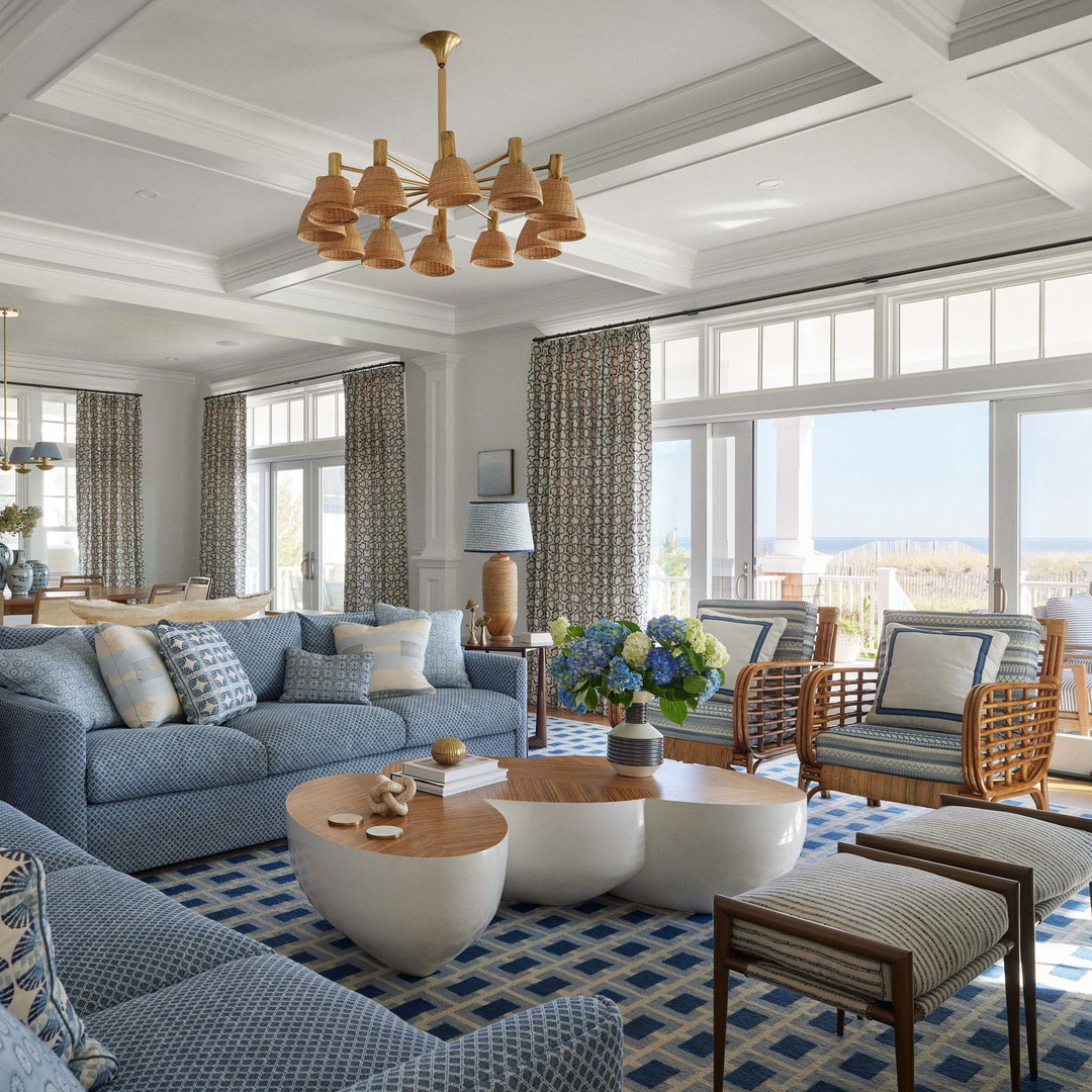 a living room filled with furniture and a chandelier