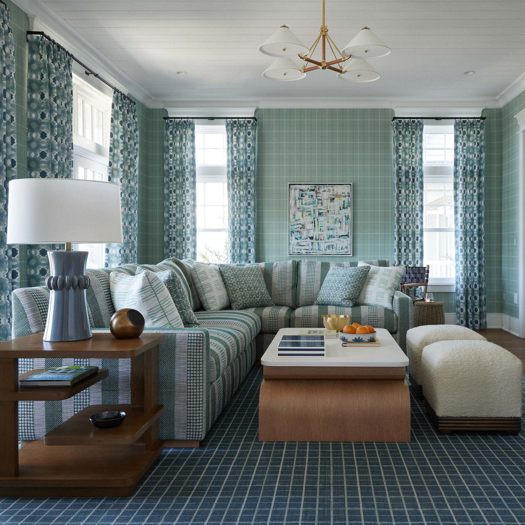 a living room filled with furniture and a flat screen tv