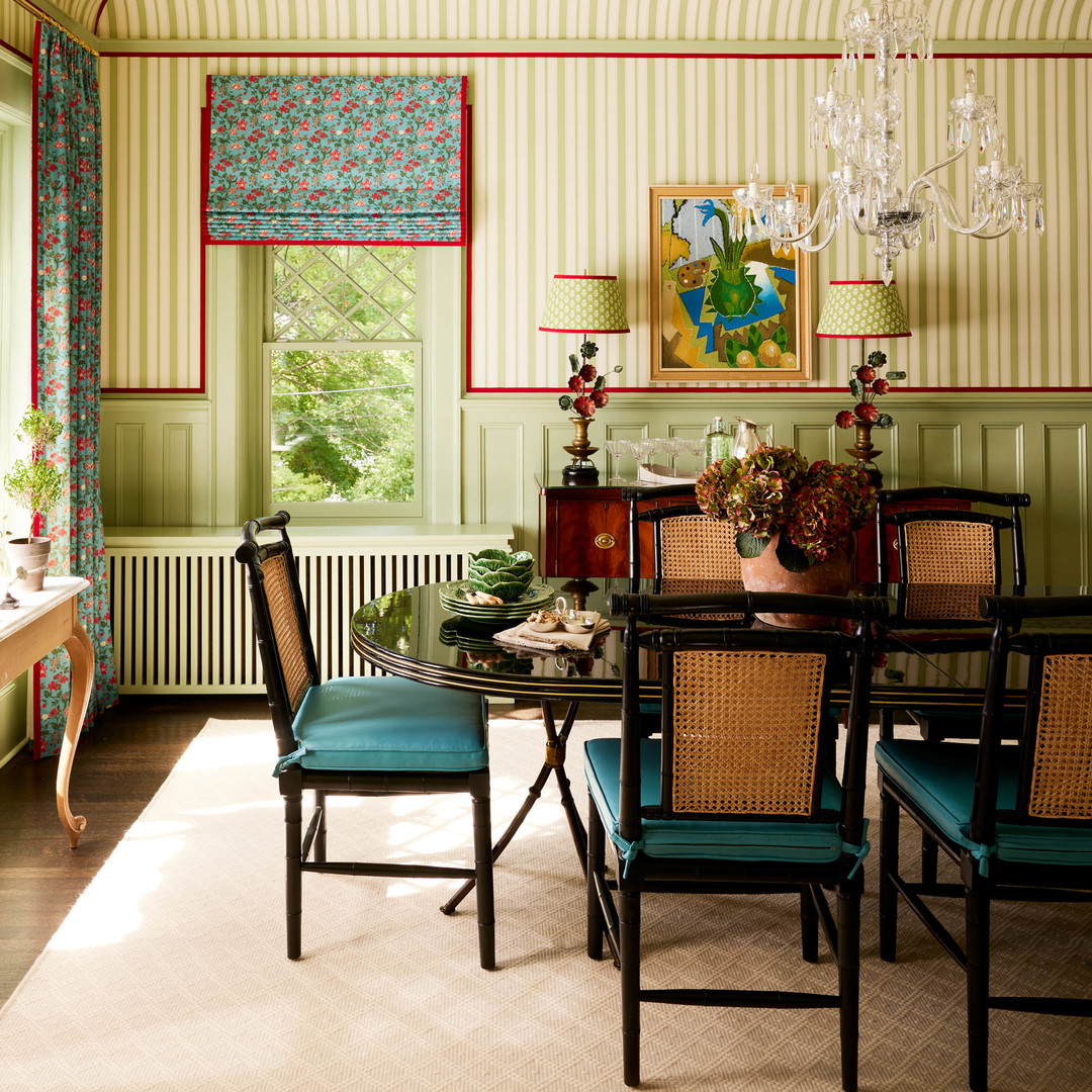 a dining room with a table and chairs and a chandelier