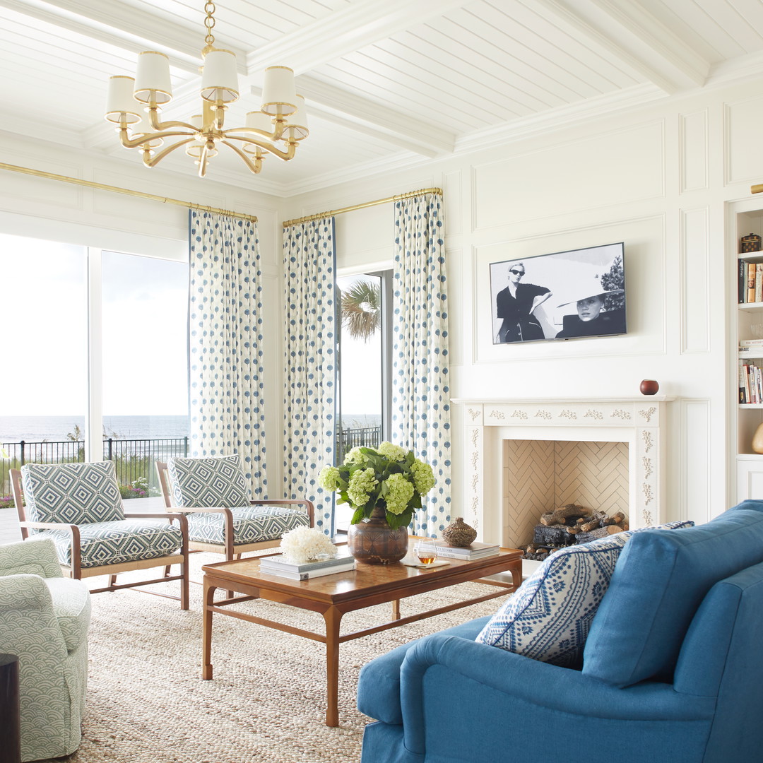 a living room filled with furniture and a fire place