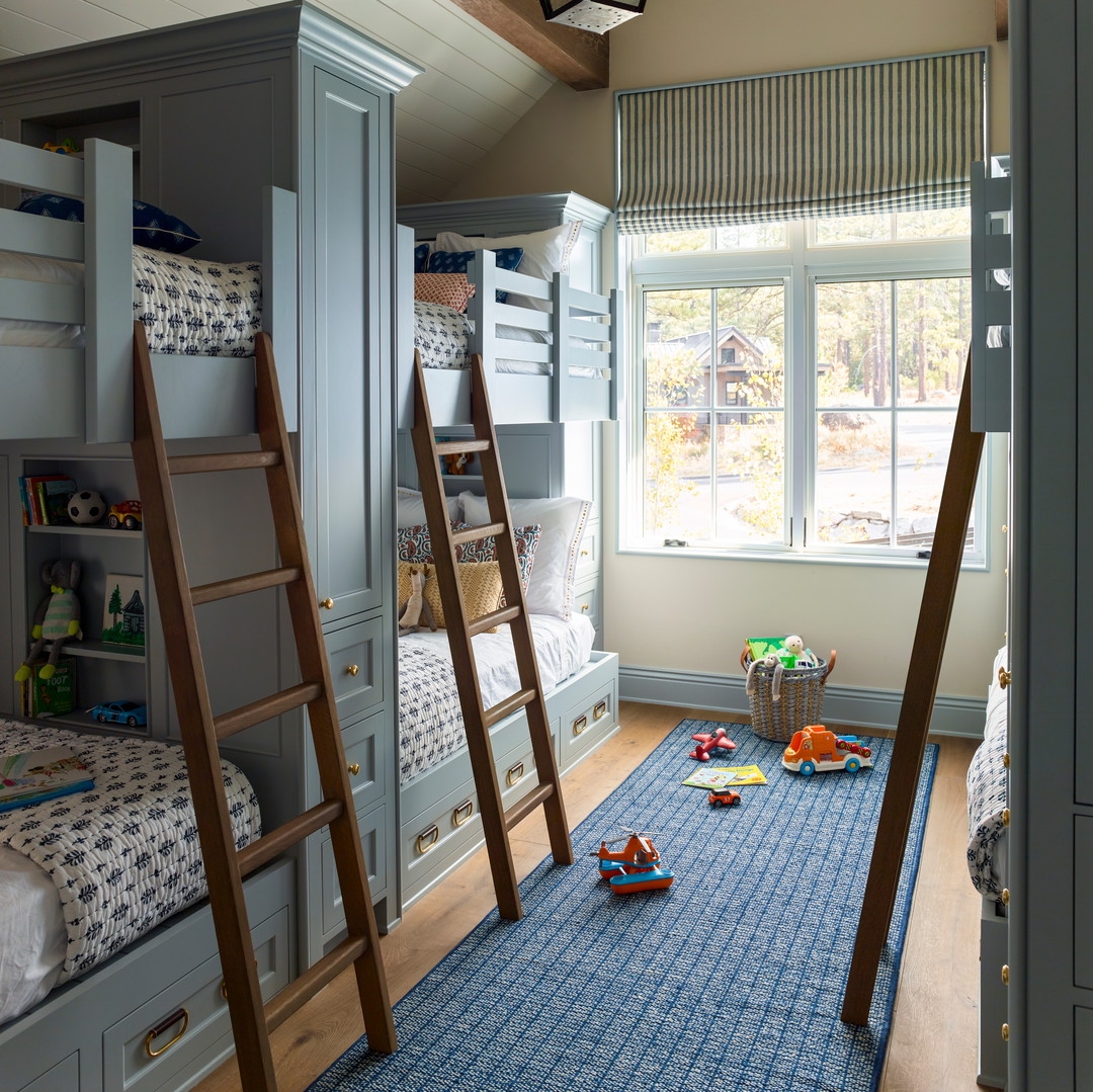 a child's bedroom with bunk beds and toys