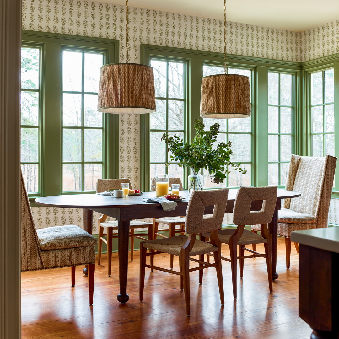 a dining room with a table and chairs