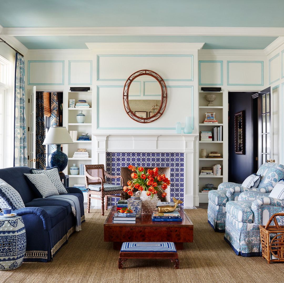 a living room filled with furniture and a fire place