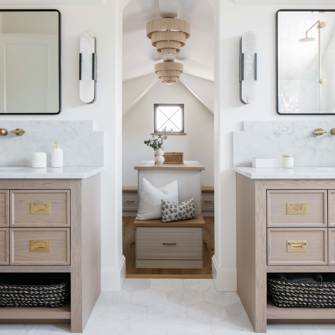 a bathroom with two sinks and a mirror