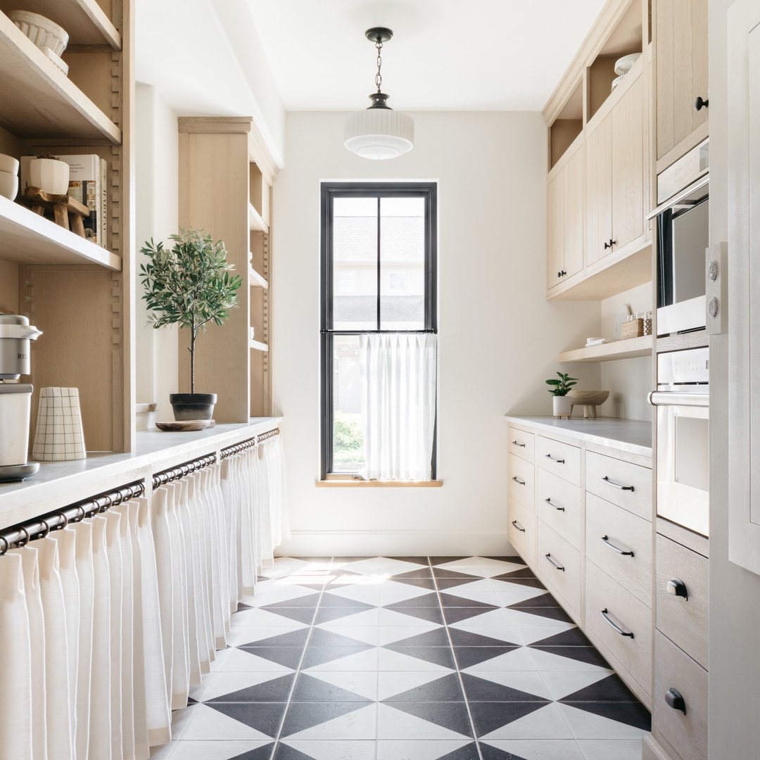 a kitchen with a black and white checkered floor