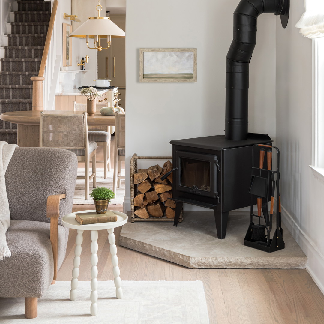 a living room filled with furniture and a fire place