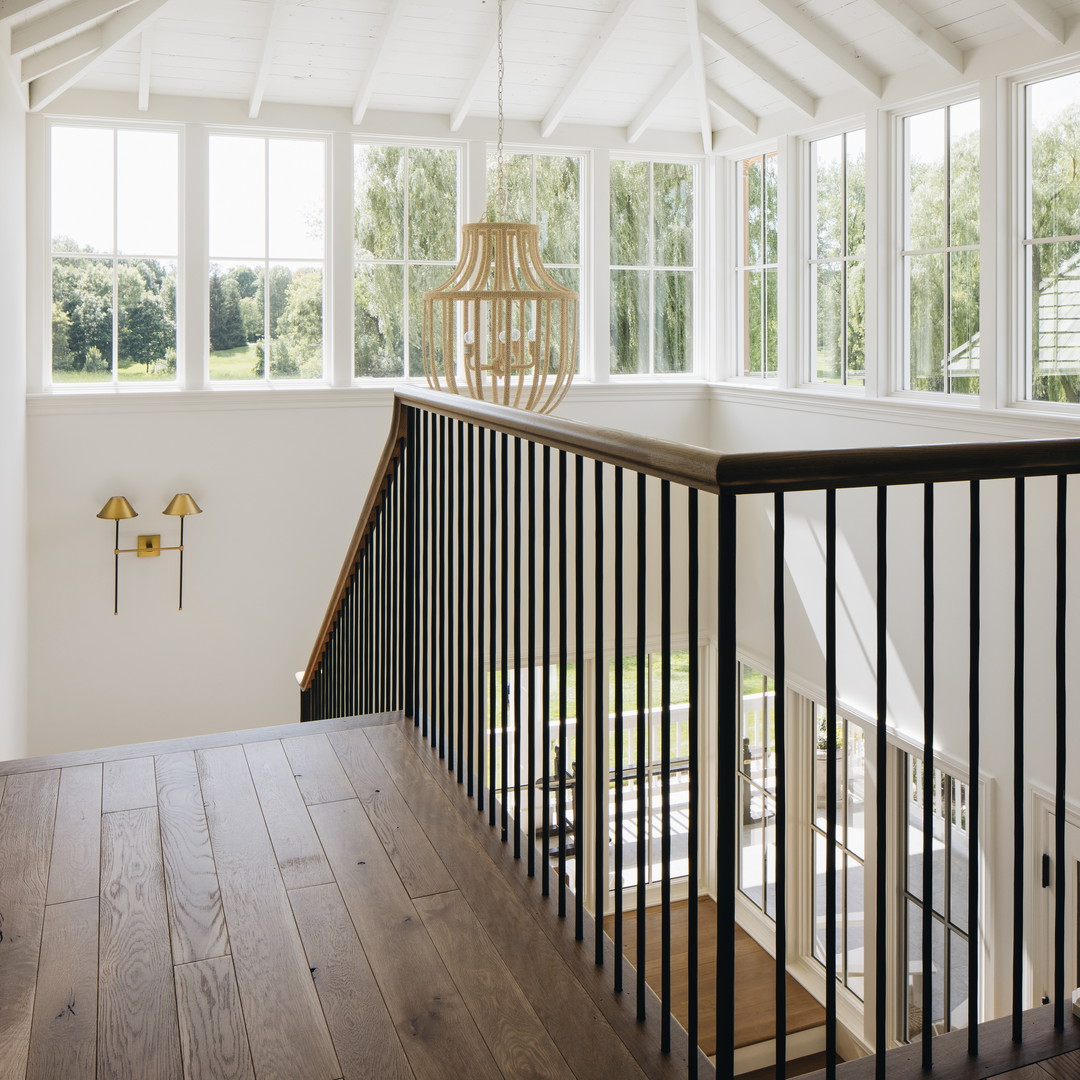 a room with a wooden floor and white walls