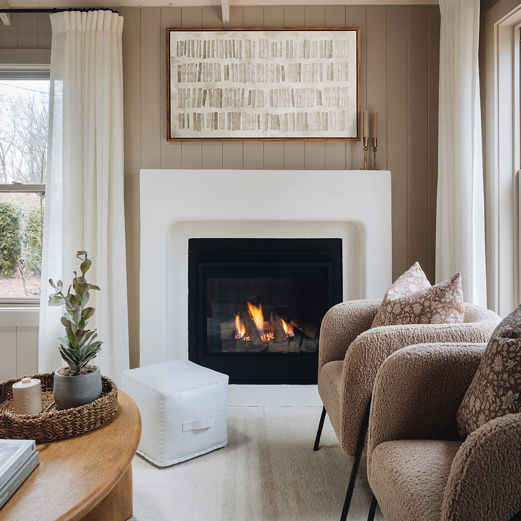 a living room filled with furniture and a fire place