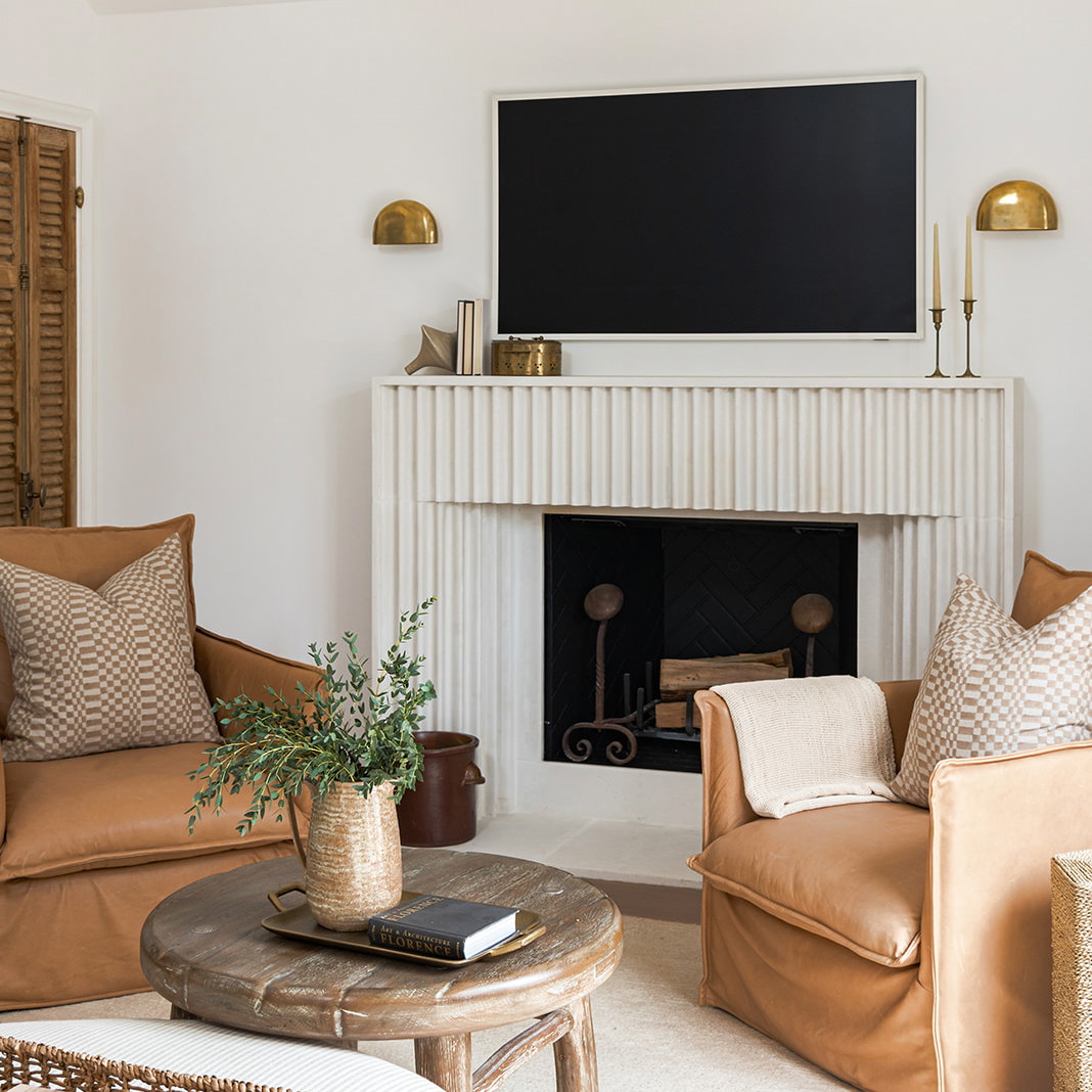 a living room filled with furniture and a flat screen tv