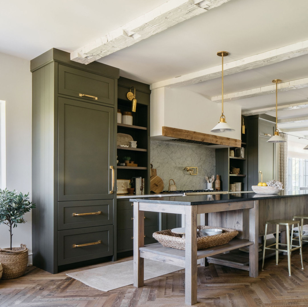 a kitchen with an island in the middle of it