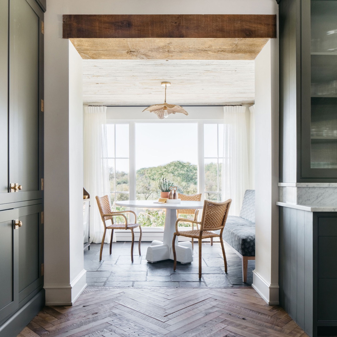 a dining room with a table and chairs