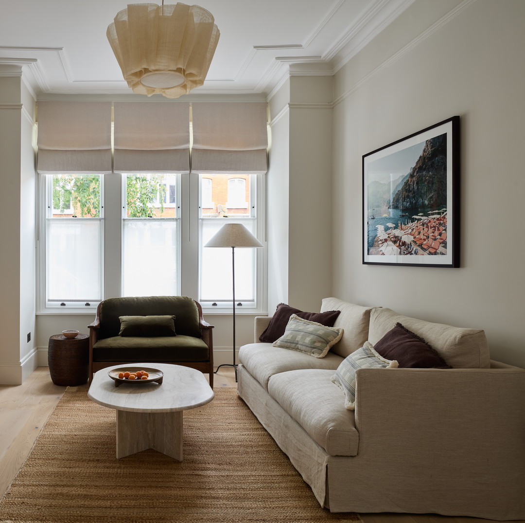 a living room filled with furniture and a fire place