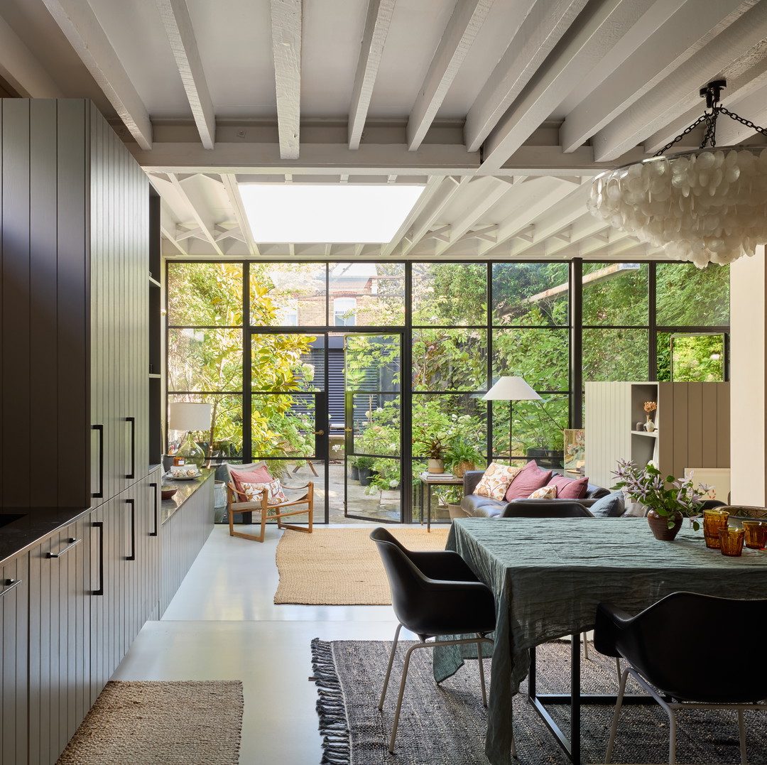 a dining room with a table and chairs