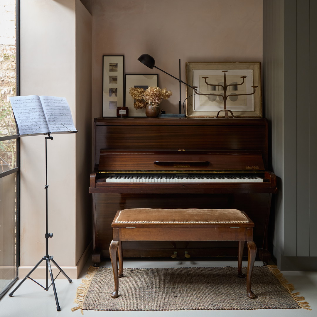 a piano and a bench in a room