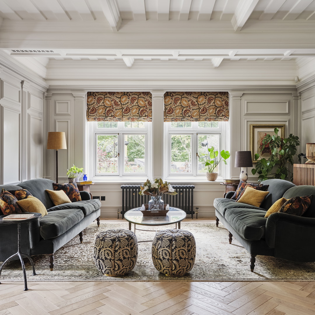 a living room filled with furniture and a large window