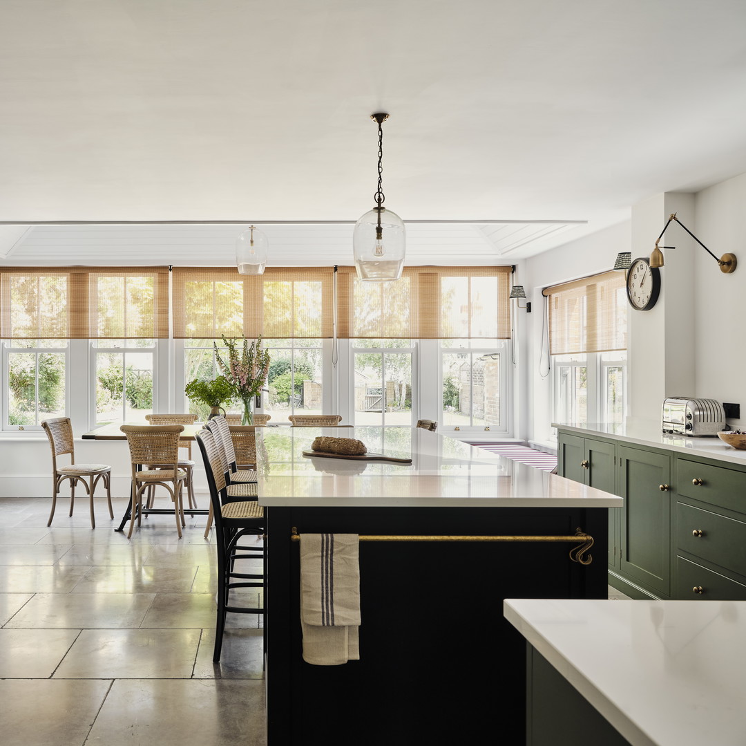 a kitchen with a center island and a large window