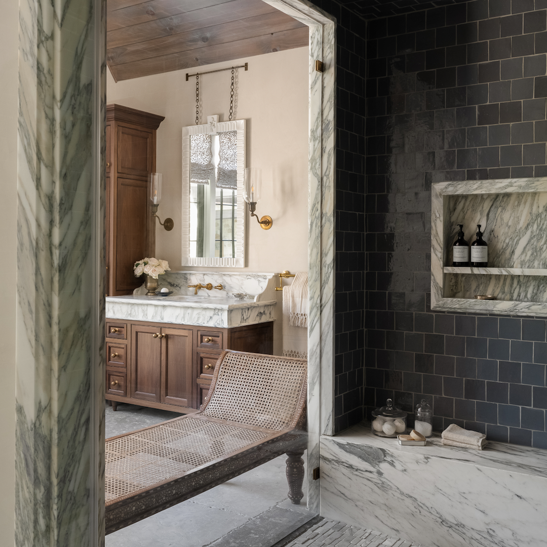 a bath room with a sink a mirror and a bath tub